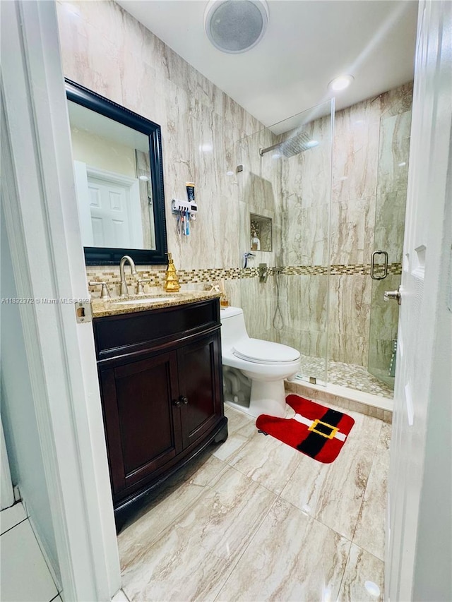 5072 W 12th Ln Unit D-14, Hialeah, FL 33012 - bathroom featuring a shower stall, vanity, and tile walls