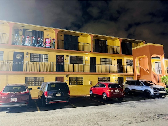 5072 W 12th Ln Unit D-14, Hialeah, FL 33012 - view of property featuring uncovered parking