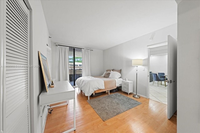 540 Brickell Key Dr Unit 412, Miami, FL 33131 - bedroom with access to outside and light wood-style floors