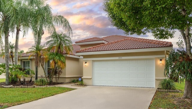 2373 NW 195th Ave, Pembroke Pines, FL 33029 - mediterranean / spanish-style home featuring stucco siding, driveway, an attached garage, and a tiled roof