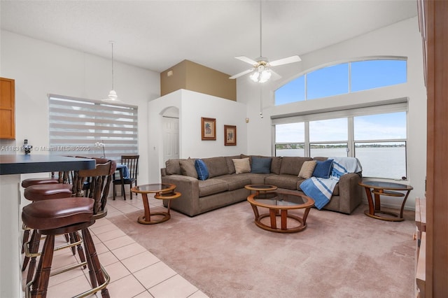 2373 NW 195th Ave, Pembroke Pines, FL 33029 - living room with light colored carpet, light tile patterned floors, a towering ceiling, a ceiling fan, and a water view