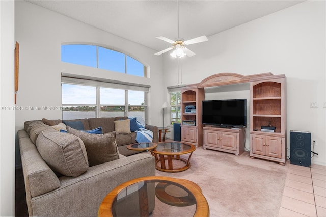 2373 NW 195th Ave, Pembroke Pines, FL 33029 - living area with a high ceiling, ceiling fan, light tile patterned floors, and light carpet