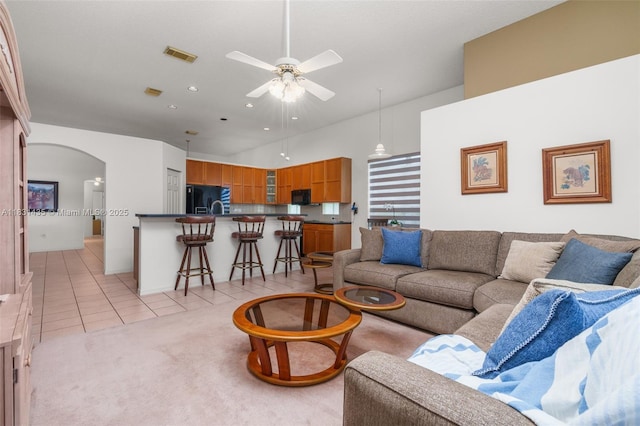 2373 NW 195th Ave, Pembroke Pines, FL 33029 - living room with light tile patterned flooring, arched walkways, ceiling fan, recessed lighting, and a high ceiling