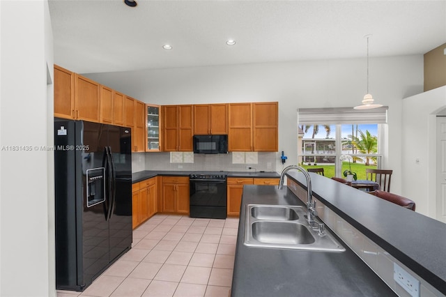 2373 NW 195th Ave, Pembroke Pines, FL 33029 - kitchen with black appliances, light tile patterned floors, tasteful backsplash, vaulted ceiling, and dark countertops