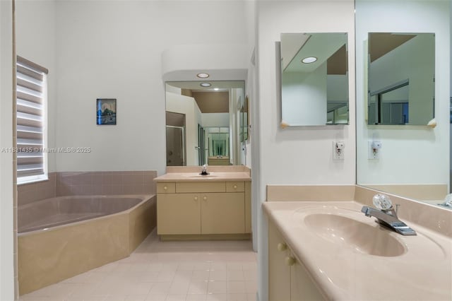 2373 NW 195th Ave, Pembroke Pines, FL 33029 - bathroom featuring a bath, tile patterned floors, two vanities, and a shower stall