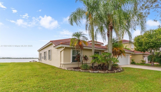 2373 NW 195th Ave, Pembroke Pines, FL 33029 - view of front of property with stucco siding, a water view, driveway, a tiled roof, and a front lawn