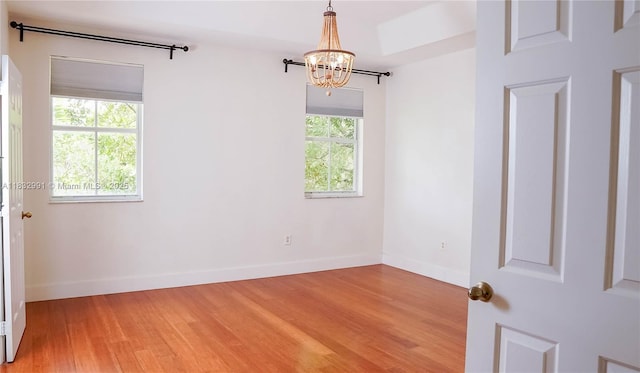 1491 SE 25th Ter Unit 1491, Homestead, FL 33035 - unfurnished room with a chandelier and light wood-style flooring