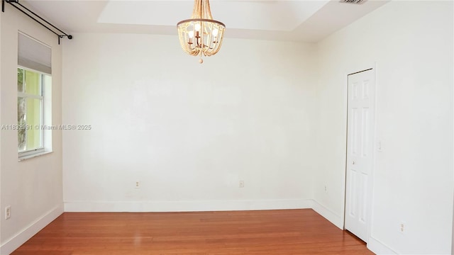 1491 SE 25th Ter Unit 1491, Homestead, FL 33035 - spare room with a chandelier and wood finished floors
