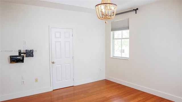 1491 SE 25th Ter Unit 1491, Homestead, FL 33035 - empty room with a chandelier and wood finished floors