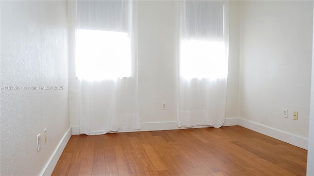 1491 SE 25th Ter Unit 1491, Homestead, FL 33035 - empty room with light wood-style flooring and baseboards