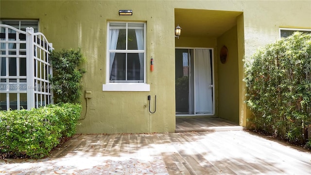 1491 SE 25th Ter Unit 1491, Homestead, FL 33035 - property entrance with stucco siding and a patio area