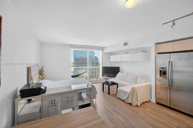4250 Biscayne Blvd Unit 1206, Miami, FL 33137 - living room featuring light wood-type flooring and rail lighting