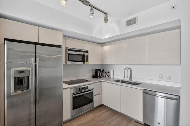 4250 Biscayne Blvd Unit 1206, Miami, FL 33137 - kitchen with stainless steel appliances, rail lighting, light countertops, light wood-type flooring, and modern cabinets