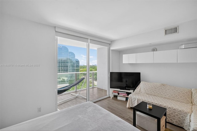 4250 Biscayne Blvd Unit 1206, Miami, FL 33137 - living area featuring wood finished floors and a wall of windows