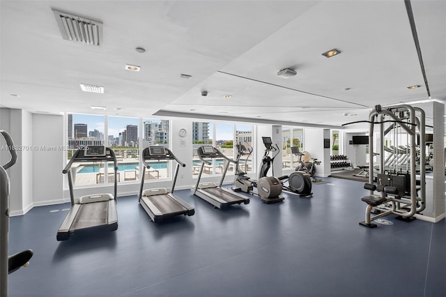 4250 Biscayne Blvd Unit 1206, Miami, FL 33137 - exercise room featuring baseboards and a skyline view