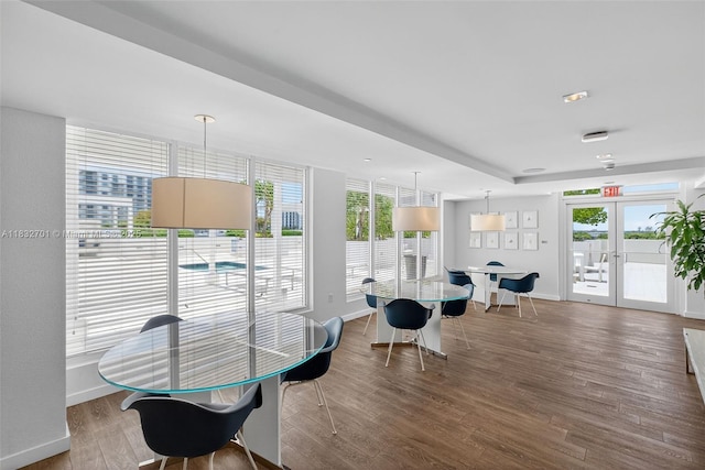 4250 Biscayne Blvd Unit 1206, Miami, FL 33137 - dining area with healthy amount of natural light, french doors, and wood finished floors