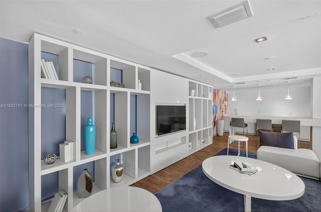 4250 Biscayne Blvd Unit 1206, Miami, FL 33137 - living room featuring baseboard heating, wood finished floors, and a raised ceiling