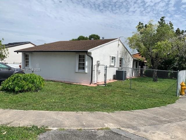 13375 NW 3rd Ter, Miami, FL 33182 - view of home's exterior with stucco siding and a central air condition unit