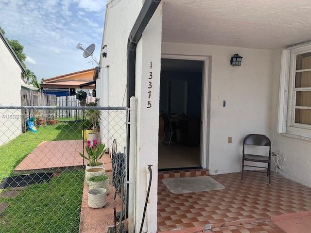 13375 NW 3rd Ter, Miami, FL 33182 - entrance to property featuring stucco siding
