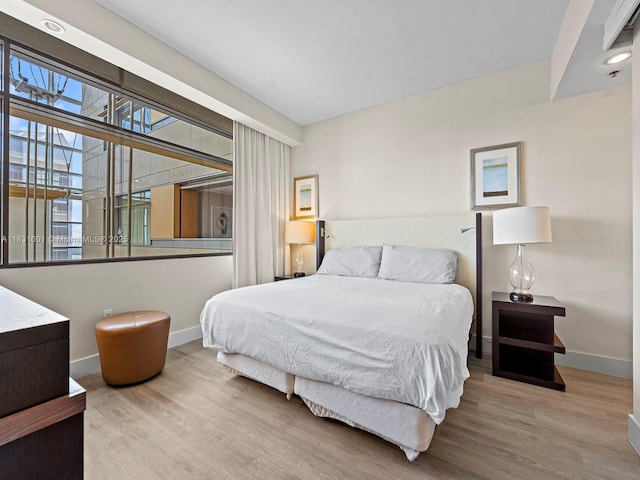 1395 Brickell Ave Unit 3310, Miami, FL 33131 - bedroom featuring wood finished floors