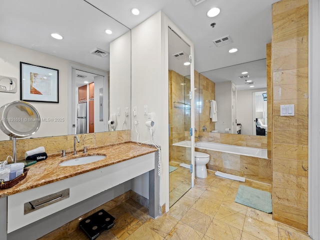 1395 Brickell Ave Unit 3310, Miami, FL 33131 - full bath featuring a garden tub, tiled shower, vanity, recessed lighting, and marble finish floors
