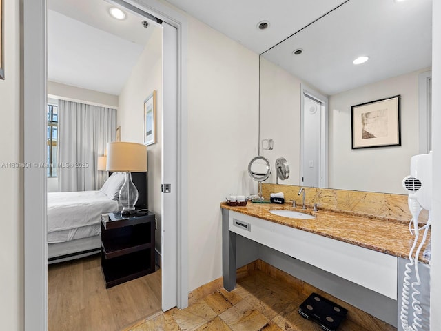 1395 Brickell Ave Unit 3310, Miami, FL 33131 - bathroom with vanity, wood finished floors, and recessed lighting