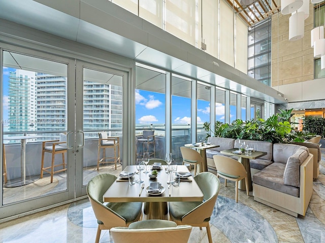 1395 Brickell Ave Unit 3310, Miami, FL 33131 - dining space featuring healthy amount of natural light and a high ceiling