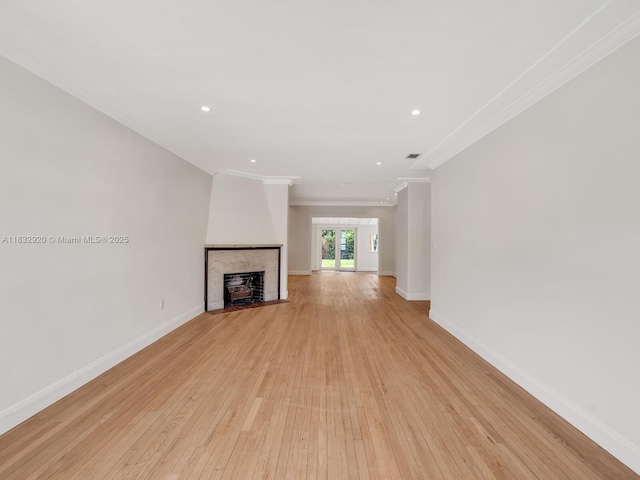 9033 Carlyle Ave, Surfside, FL 33154 - unfurnished living room with ornamental molding, light wood finished floors, a fireplace with flush hearth, and recessed lighting