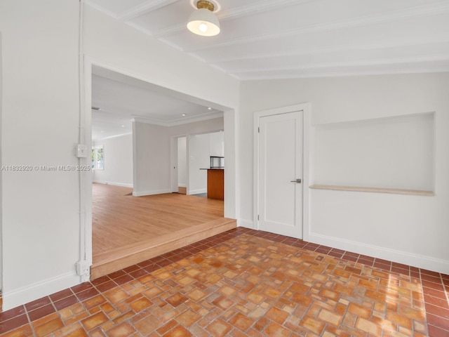 9033 Carlyle Ave, Surfside, FL 33154 - spare room featuring crown molding and beamed ceiling