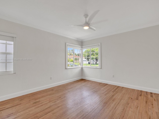 9033 Carlyle Ave, Surfside, FL 33154 - spare room featuring light wood-style flooring, a ceiling fan, and ornamental molding