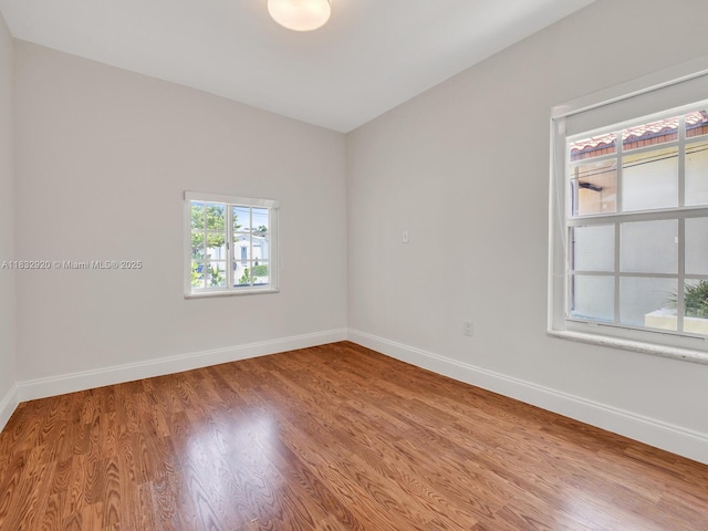 9033 Carlyle Ave, Surfside, FL 33154 - empty room with wood finished floors