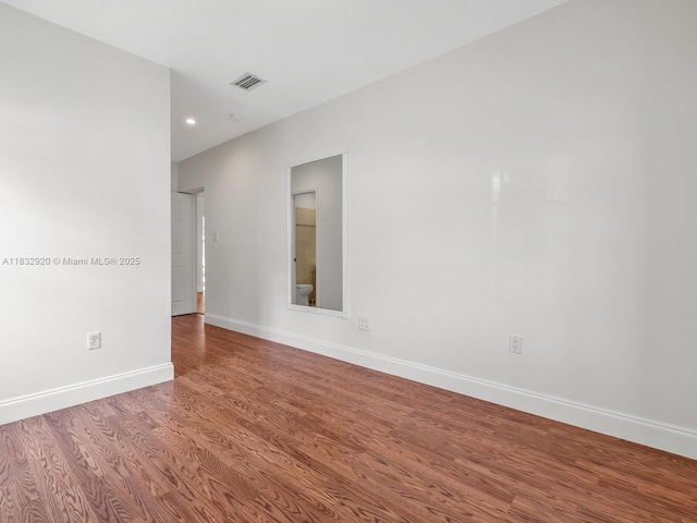 9033 Carlyle Ave, Surfside, FL 33154 - spare room featuring wood finished floors and recessed lighting