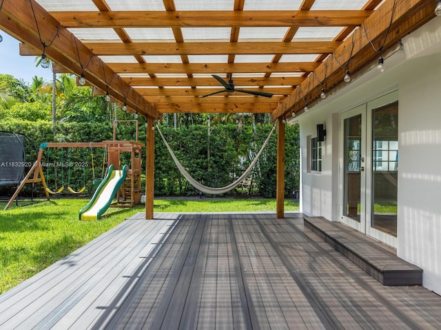 9033 Carlyle Ave, Surfside, FL 33154 - wooden terrace with a playground, french doors, a lawn, and a ceiling fan