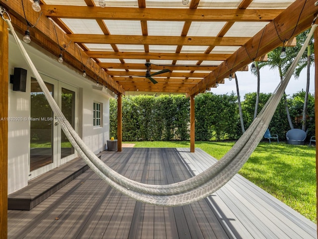 9033 Carlyle Ave, Surfside, FL 33154 - wooden terrace with a ceiling fan, a yard, and french doors