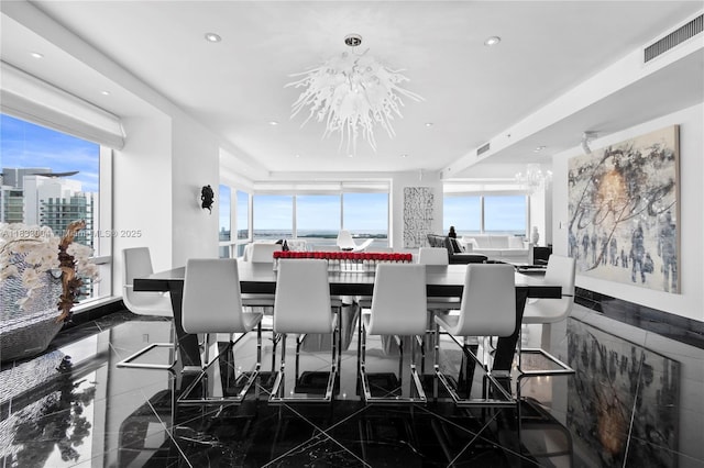 1425 Brickell Ave Unit 42E, Miami, FL 33131 - dining area featuring a chandelier, recessed lighting, and marble tiled flooring
