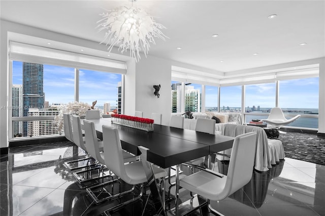 1425 Brickell Ave Unit 42E, Miami, FL 33131 - dining room with a view of city, a chandelier, and recessed lighting