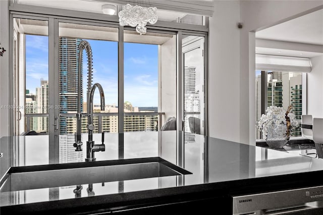 1425 Brickell Ave Unit 42E, Miami, FL 33131 - kitchen with a view of city, a chandelier, and dark countertops