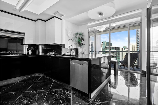 1425 Brickell Ave Unit 42E, Miami, FL 33131 - kitchen featuring dishwasher, dark marble finish floors, dark countertops, modern cabinets, and a view of city