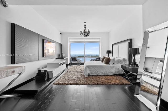 1425 Brickell Ave Unit 42E, Miami, FL 33131 - bedroom with a water view, a chandelier, and wood finished floors