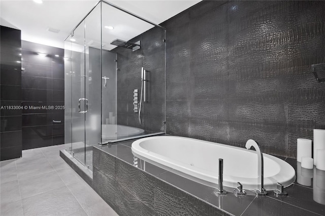 1425 Brickell Ave Unit 42E, Miami, FL 33131 - full bath featuring a bath, a stall shower, and tile patterned flooring
