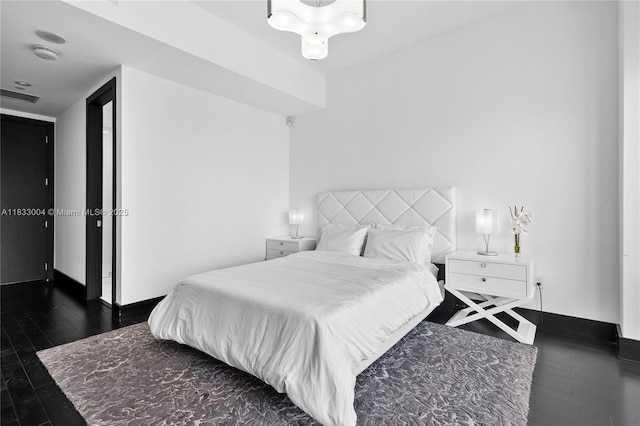 1425 Brickell Ave Unit 42E, Miami, FL 33131 - bedroom with hardwood / wood-style floors and baseboards