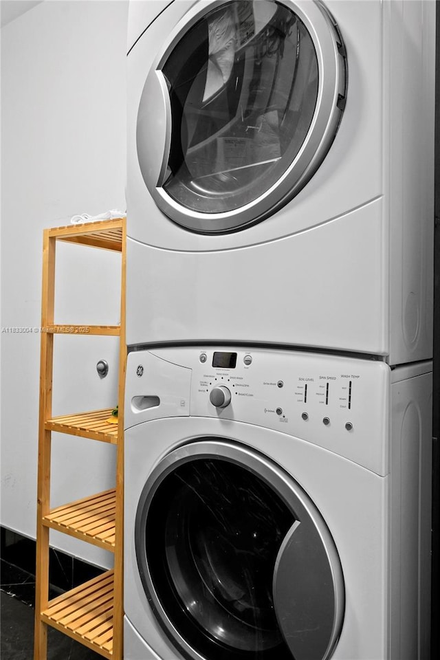 1425 Brickell Ave Unit 42E, Miami, FL 33131 - laundry room with stacked washing machine and dryer