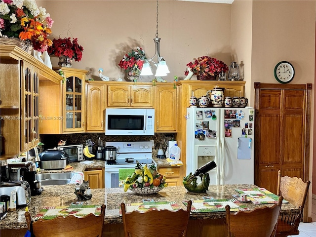 5450 SW 143rd Ct, Miami, FL 33175 - kitchen featuring white appliances, a peninsula, glass insert cabinets, decorative backsplash, and pendant lighting