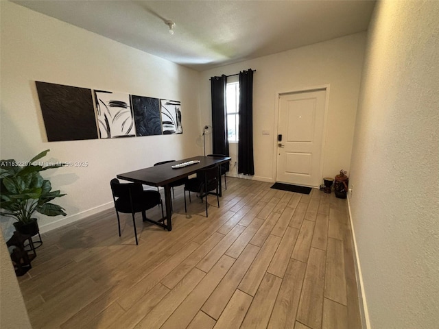 830 SE 19th St, Homestead, FL 33034 - dining space with light wood-style floors and baseboards