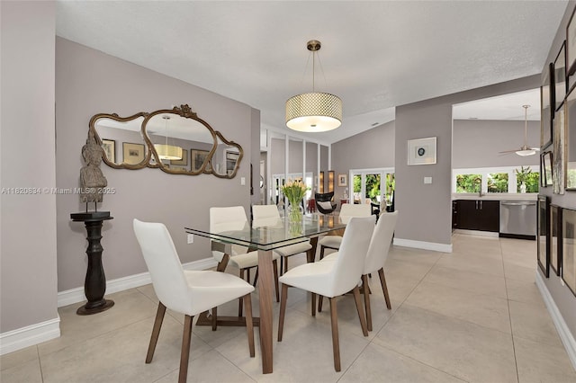 14460 Glencairn Rd, Miami Lakes, FL 33016 - dining area with vaulted ceiling and light tile patterned floors