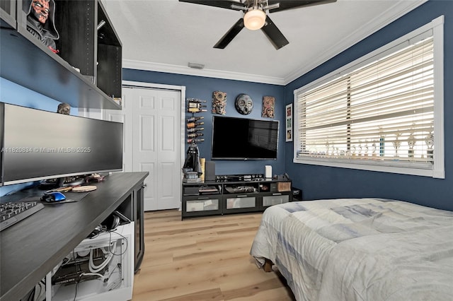 14460 Glencairn Rd, Miami Lakes, FL 33016 - bedroom featuring light wood-style flooring, crown molding, an office area, ceiling fan, and a closet