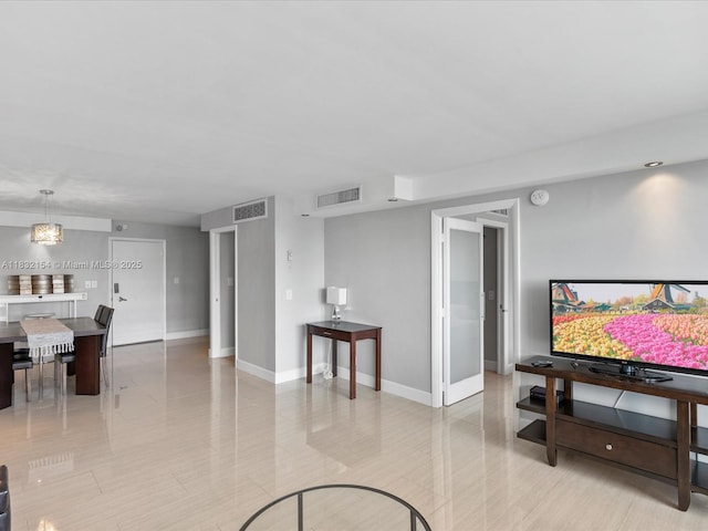 6770 Indian Creek Dr Ph-R, Ph-R Miami Beach, FL 33141 - living room with baseboards and light tile patterned flooring