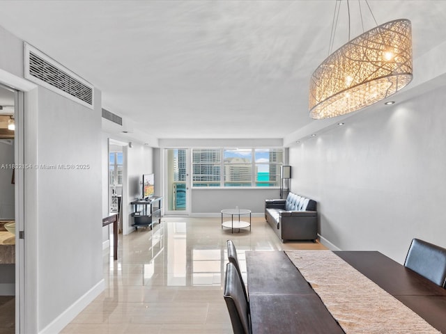 6770 Indian Creek Dr Ph-R, Ph-R Miami Beach, FL 33141 - dining space featuring baseboards and a chandelier