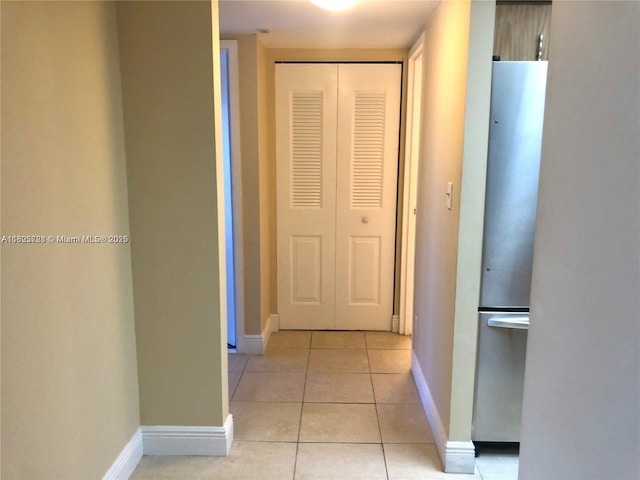 5995 Washington St Unit 233, Hollywood, FL 33023 - hallway with light tile patterned flooring and baseboards