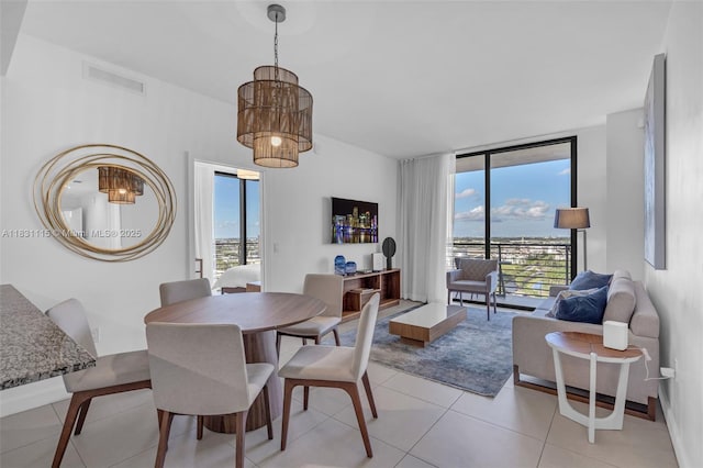 5350 NW 84th Ave Unit 1513, Doral, FL 33166 - dining area with light tile patterned floors and floor to ceiling windows